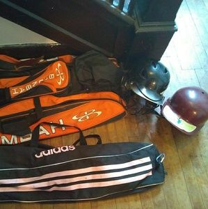 Baseball or softball bags. 2 helmets.